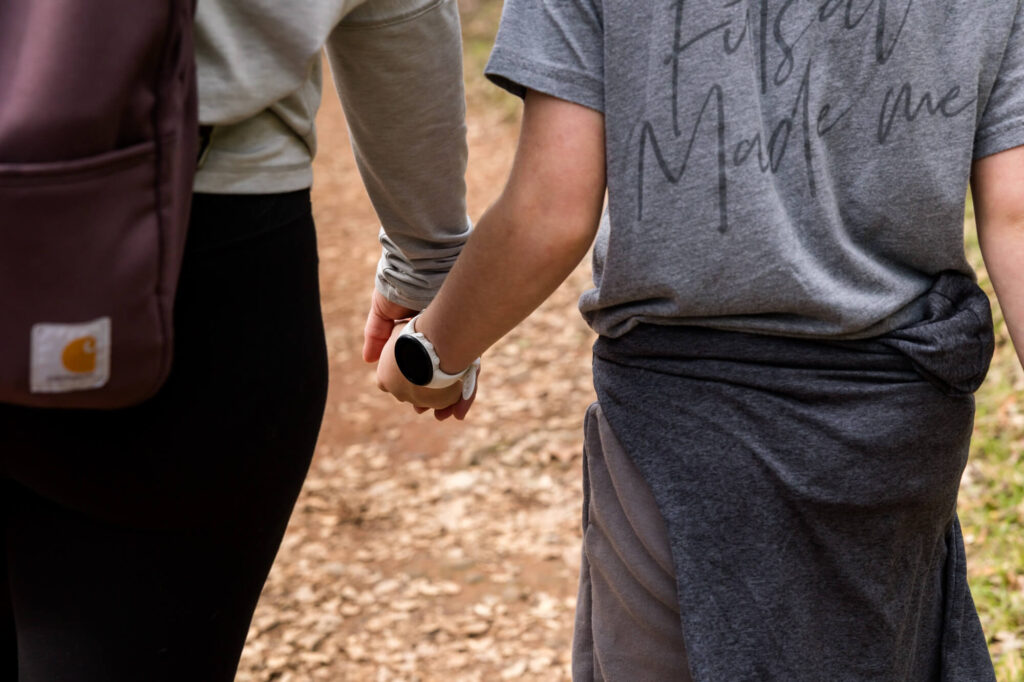 Mom and son holding hands on a walk in Auburn, CA